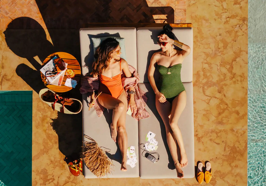 MARPH-P0238-Oasis-Pool-Three-Women-Sunbed-Pool.16x9